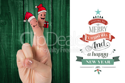 Composite image of christmas fingers