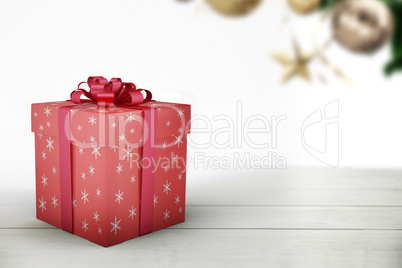 A red Christmas gift with ribbon