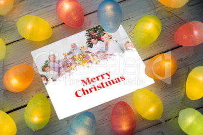 Composite image of christmas lights on table