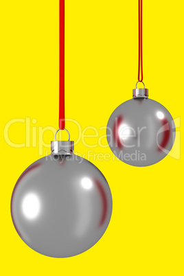 Two Christmas balls hanging on ribbon