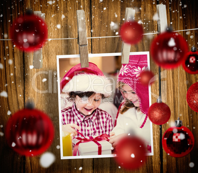 Composite image of christmas baubles