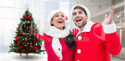 Composite image of festive young couple