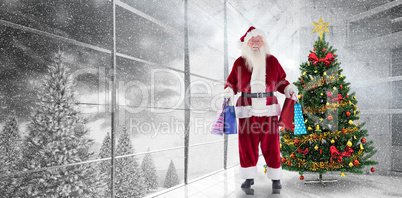 Composite image of santa carries some christmas bags