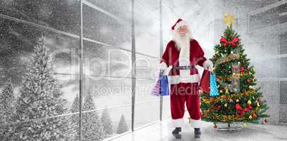 Composite image of santa carries some christmas bags