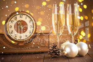 Christmas card. Glasses of champagne on New Year's Eve on the stand an ancient clock with snow