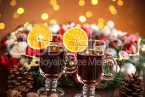 Christmas hot mulled wine with spices on a wooden table. The idea for creating greeting cards