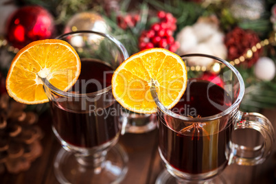 Christmas hot mulled wine with spices on a wooden table. The idea for creating greeting cards