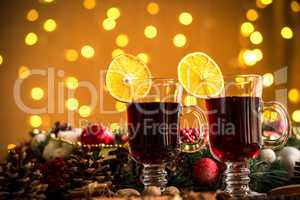 Christmas hot mulled wine with spices on a wooden table. The idea for creating greeting cards