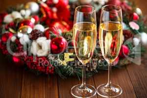 Two champagne glass on christmas background