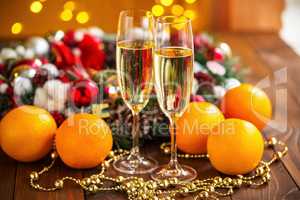 Two champagne glass on christmas bokeh background