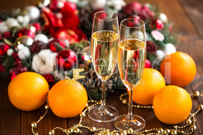 Two champagne glass on christmas bokeh background