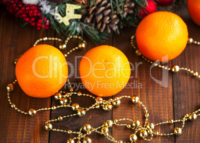 Oranges on the Wood Table with Christmas Background