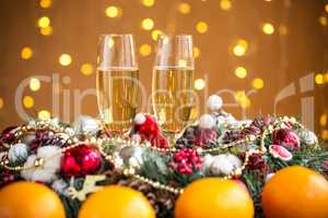 Two champagne glass on christmas bokeh background