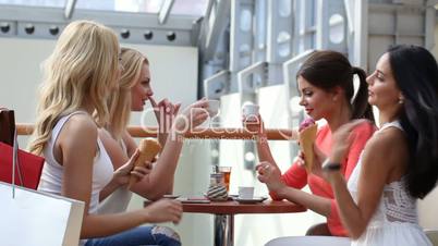 Friends talking in cafe