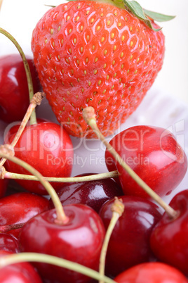 Background from fresh ripe strawberries and cherry