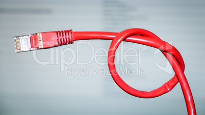 red networking cable with a knot