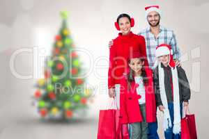 Composite image of  happy family looking at camera