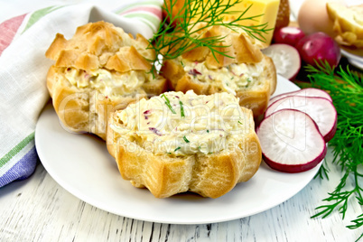 Appetizer of radish and cheese in profiteroles on plate