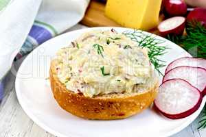 Appetizer of radish and cheese on bun in plate with dill