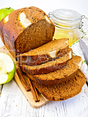 Bread apple with honey on light board