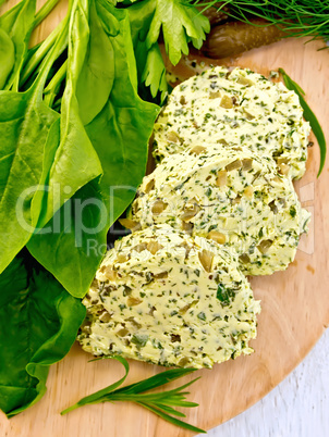 Butter with spinach and greens on board