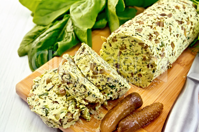 Butter with spinach and greens on light board