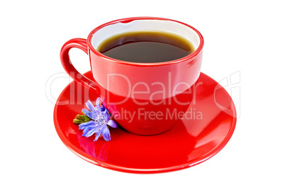 Chicory drink in red cup with blue flower