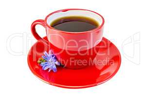 Chicory drink in red cup with blue flower
