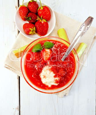 Dessert strawberry-vanilla and rhubarb in glassful on board top