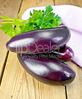Eggplant with parsley on the board