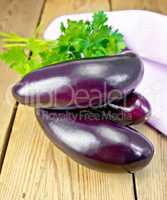 Eggplant with parsley on the board