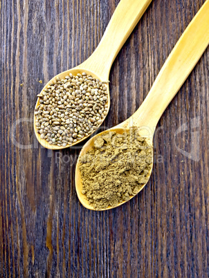 Flour and seed of hemp in spoon on board top