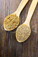 Flour and seed of hemp in wooden spoon on board