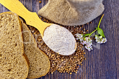 Flour buckwheat in spoon with grains on board top