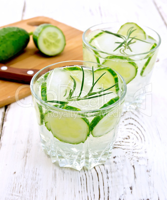 Lemonade with cucumber and rosemary in two glassful on white boa