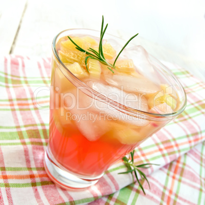 Lemonade with rhubarb and rosemary on pink napkin