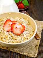Oatmeal with strawberry on board