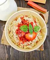 Oatmeal with strawberry-rhubarb sauce on board top