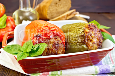 Pepper stuffed meat in brown roaster on table