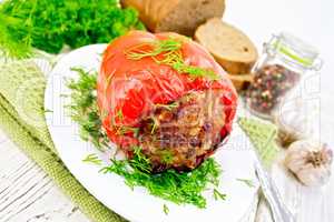 Pepper stuffed meat with dill in plate on table