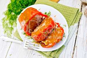 Pepper stuffed meat with sauce in plate on table