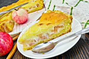 Pie apple with sour cream and cinnamon on board