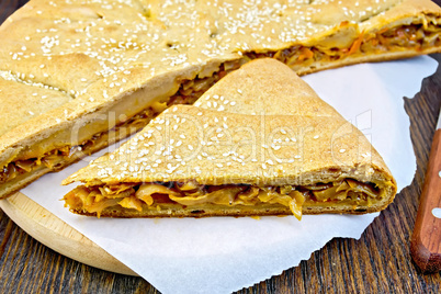 Pie with cabbage and sesame on paper