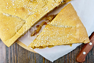 Pie with cabbage and sesame on parchment top