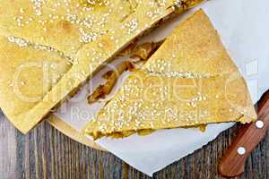 Pie with cabbage and sesame on parchment top