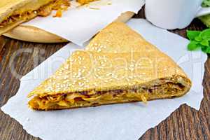 Pie with cabbage and sesame on parchment