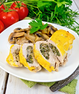 Roll chicken with champignons and cheese on board
