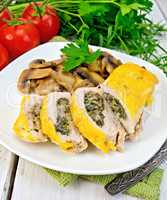 Roll chicken with champignons and cheese on board