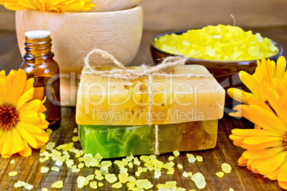 Soap homemade and salt with calendula on board