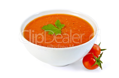 Soup tomato in white bowl with cherry tomatoes